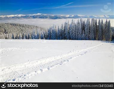 winter calm mountain landscape (view from Bukovel ski resort (Ukraine) to Svydovets ridge)