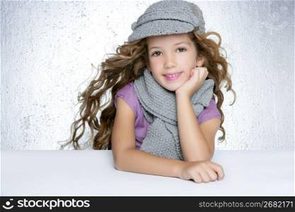 winter cap wool scarf litle fashion girl wind on hair portrait gray background