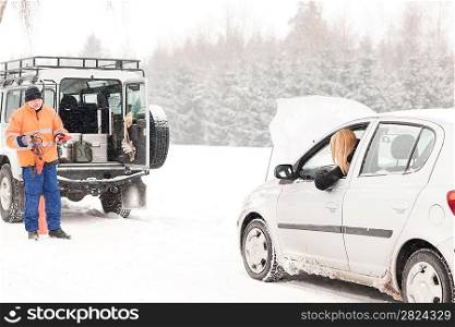 Winter car assistance man help woman breakdown snow road problem