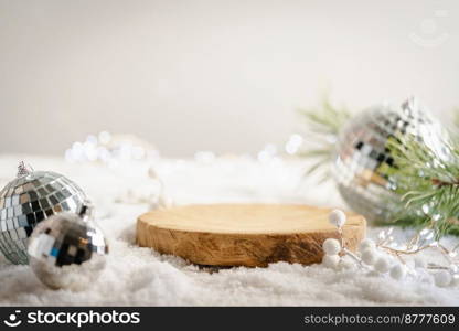 Winter Christmas composition with geometric shapes podiums and christmas decorations in snow. Empty pedestal for product presentation and for advertising display. Winter Christmas composition