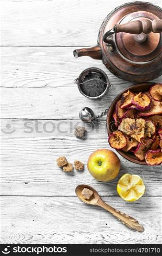 Winter cough tea. kettle with herbal tea treatment with dry apples