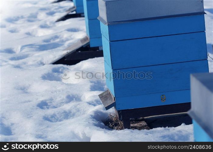 Winter country scene with beehives covered with snow .. Winter country scene with beehives covered with snow