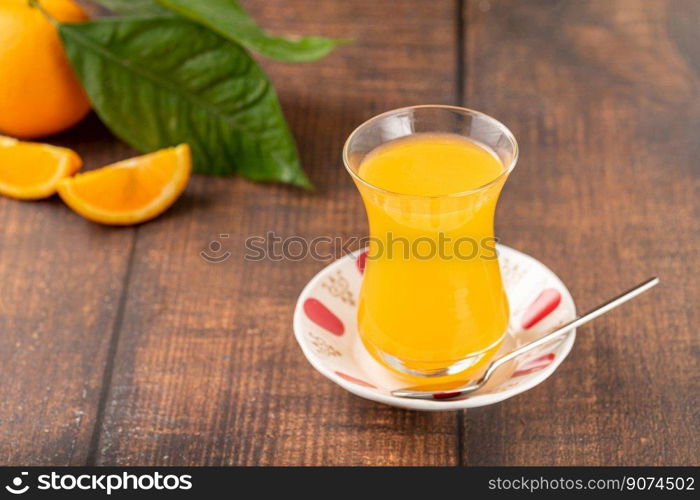 Winter drink orange oralet or oralette in a thin-waisted glass tea glass