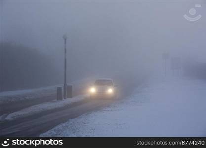 Winter driving in freezing fog on a country road in Yorkshire in the United Kingdom.