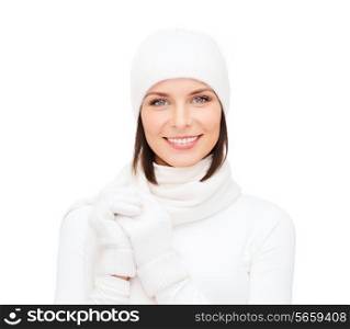 winter fashion andhappy people concept - woman in white hat, muffler and gloves