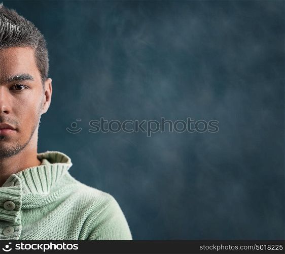 Winter fashion man portrait with frost makeup on dark smoky background
