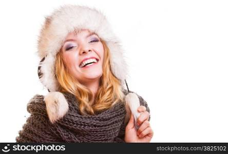 Winter fashion. Portrait positive teen girl in warm clothes. Happy young woman in fur hat doing fun isolated.
