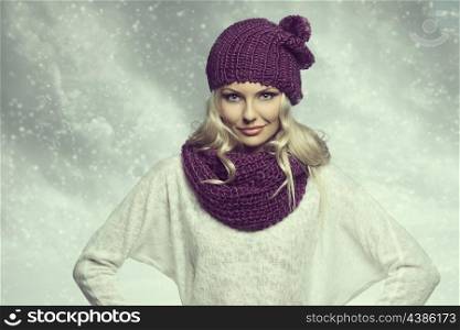 winter girl in white and purple with hat and scarf under snow with cloudy sky in background