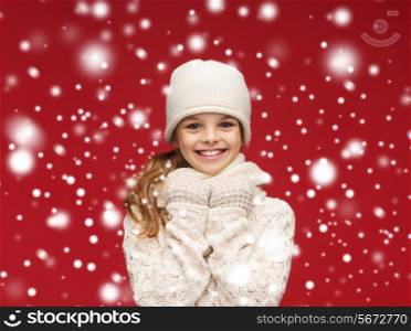 winter, happiness, christmas concept - smiling girl in white hat, scarf and gloves
