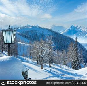 Winter hazy veiw from Dachstein mountain massif (Austria) and lamp near hotel entrance