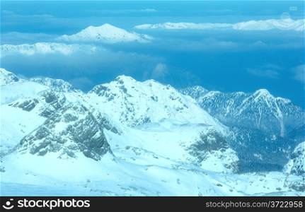 Winter hazy view from Dachstein mountain massif top (Austria).