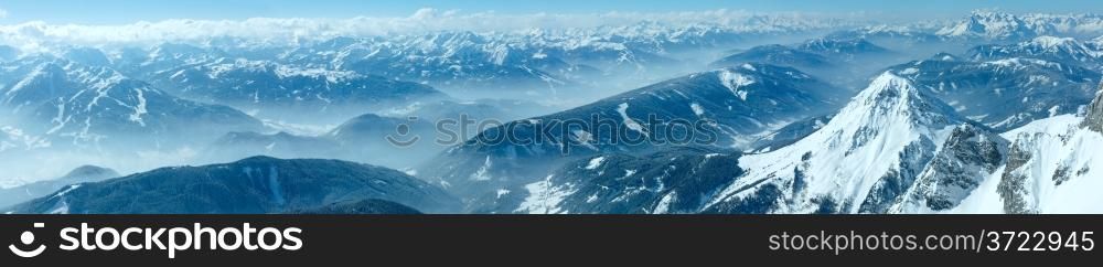 Winter hazy view from Dachstein mountain massif top to Schladming and Filzmoos region (Austria).