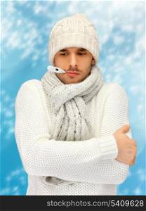 winter, health, medicine concept - sick man with thermometer in his mouth