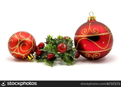 winter holiday decoration with christmas baubles and plant