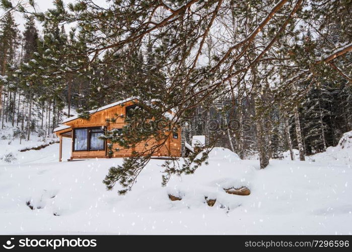 Winter holiday house in forest. Clean air, rest and relaxation. Unity with nature.. Winter holiday house in forest.