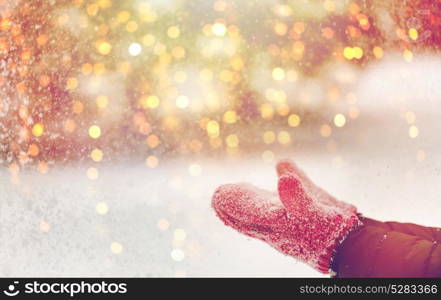 winter holidays, christmas and people concept - close up of woman throwing snow outdoors. close up of woman throwing snow outdoors