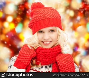 winter, holidays, christmas concept - beautiful teenage girl in hat, muffler and mittens