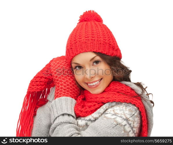 winter, holidays, clothing and people concept - smiling asian woman in red hat, scarf and mittens over white background