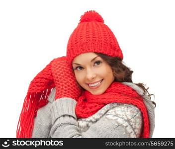 winter, holidays, clothing and people concept - smiling asian woman in red hat, scarf and mittens over white background