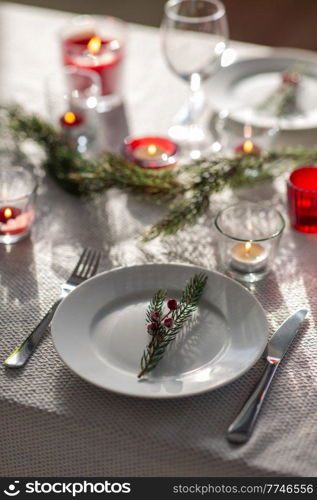 winter holidays, dinner party and celebration concept - close up of christmas table serving at home. christmas dinner party table serving at home
