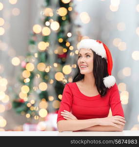 winter, holidays, happiness and people concept - smiling woman in santa helper hat over christmas tree lights background