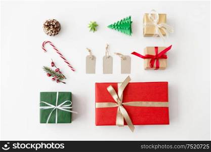 winter holidays, new year and christmas concept - set of gift boxes, tags and decorations on white background. set of christmas gifts, tags and decorations