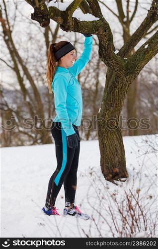 Winter holidays, spending leisure time outside. Young lady having fun on the snow. Girl is playing around, enjoying wintry weather in proper way. . Young lady having fun on snow.