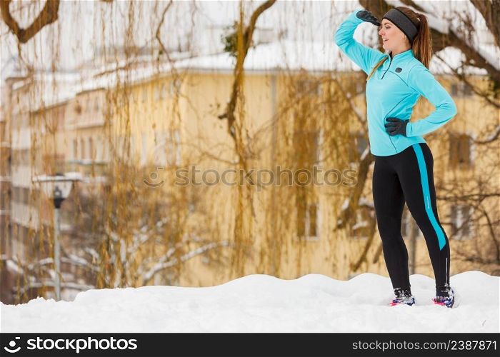 Winter holidays, spending leisure time outside. Young lady having fun on the snow. Girl is playing around, enjoying wintry weather in proper way. . Young lady having fun on snow.