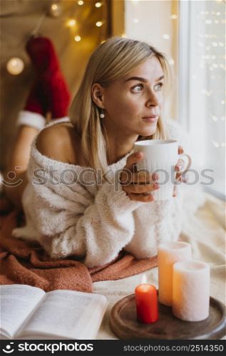 winter hygge arrangement with candles woman