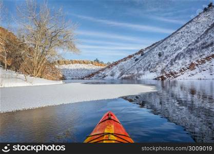 winter kayak paddling on Horsetooth Reservoir near Fort Collins in northern Colorado