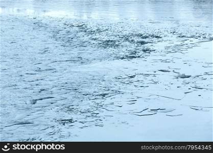 Winter lake surface with thin ice.