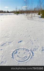 winter landscape and smiley face in the snow