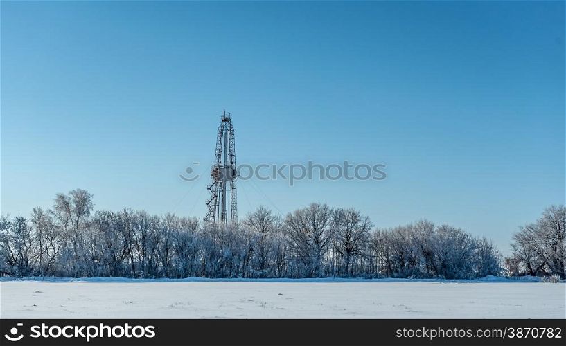 Winter landscape. Drilling rig for the snow-covered forest