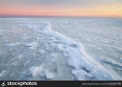 Winter landscape. Ice on water surface. Composition of nature.