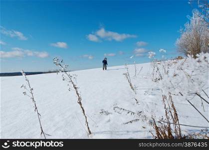 Winter landscape. Little boy playing in the snow