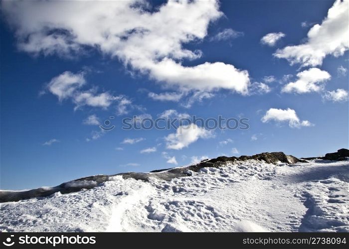 Winter landscape of snow mountain and blue sky