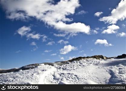 Winter landscape of snow mountain and blue sky