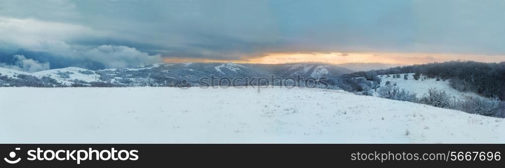 Winter landscape- panorama of winter mountains and icy forest.