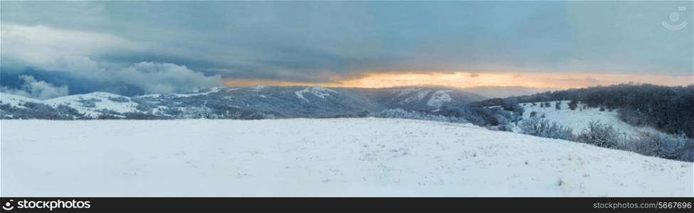Winter landscape- panorama of winter mountains and icy forest.