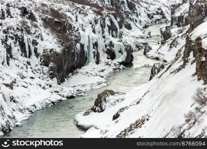 Winter landscape, river and cliff at northern Iceland