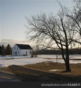 Winter landscape with a house in the background, Riverton, Hecla Grindstone Provincial Park, Manitoba, Canada
