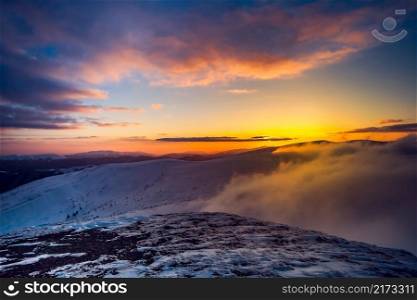 Winter landscape with a sunset. Ukraine, the Carpathian mountains.. Winter landscape 