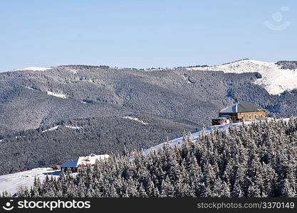 Winter landscape with ines and houses