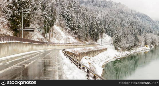 winter landscape with road along Tadami River in Fukushima Japan Panorama