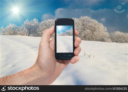 Winter mobile landscape with bright shining day