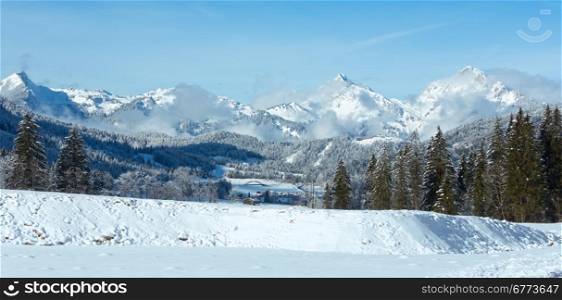 Winter mountain country landscape with fir trees (Heiterwang outskirts, Austria, Tirol)