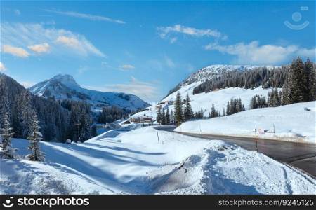 Winter mountain country panorama with fir forest (Warth outskirts, Austria).