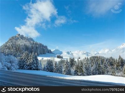 Winter mountain landscape and Ehrenberg Castle on hill top (Austria, Bavaria).