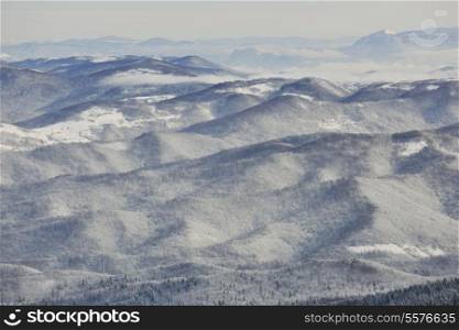 winter mountain landscape at sunny day and snow peaks