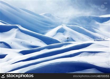 Winter mountain ski resort landscape with snow and chairlift